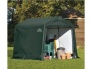 Plachtový přístřešek ShelterLogic 2,4 × 2,4 m zelený na zahradě s náčiním