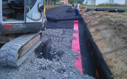 Zpevnění podkladní vrstvy komunikace u Šebetova